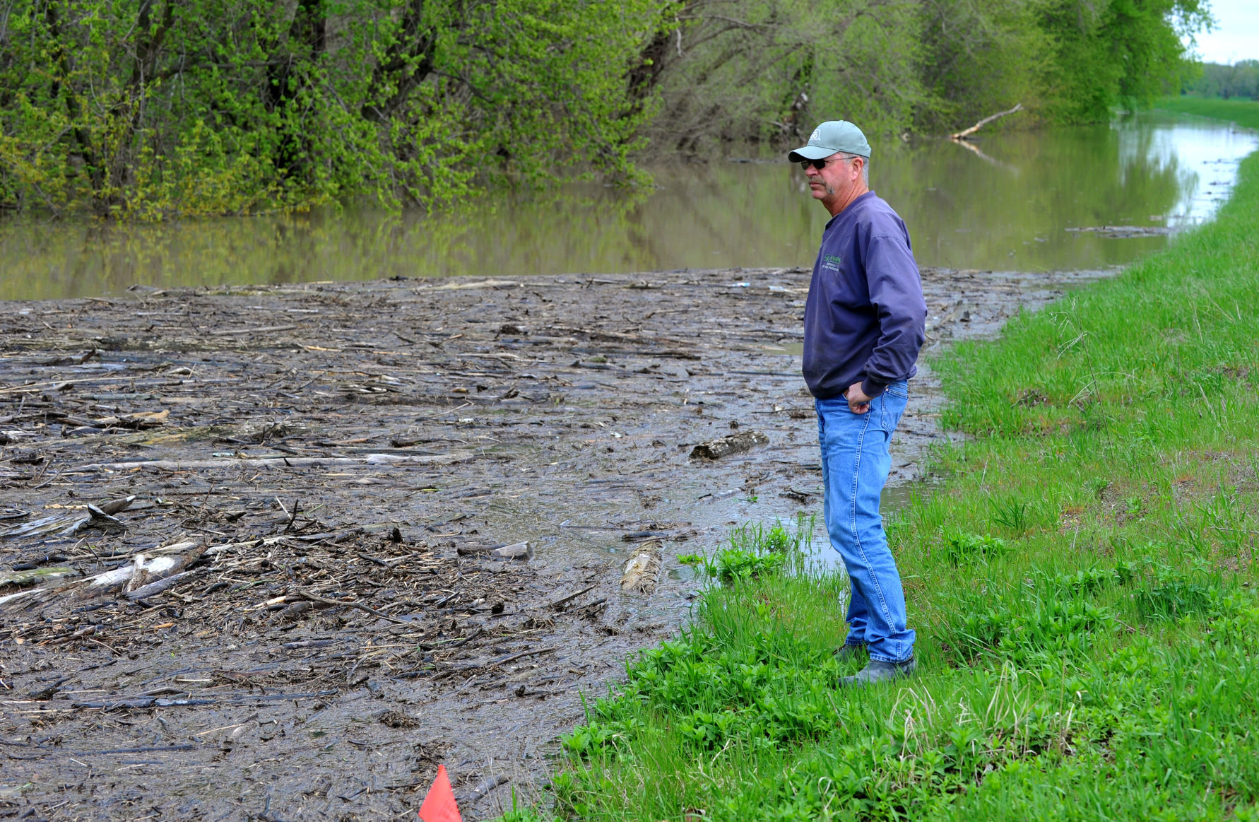 Farmers dealing with flooded fields.